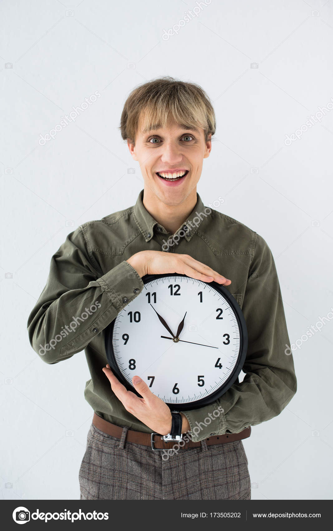 Depositphotos 173505202 stock photo businessman holding wall clock in